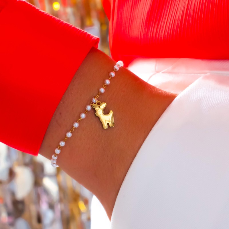 zlota-bransoletka-perelki-z-jelonkiem-ze-stali-chirurgicznej-.jpBransoletka z reniferem ze stali chirurgicznej  z perłowymi koralikami