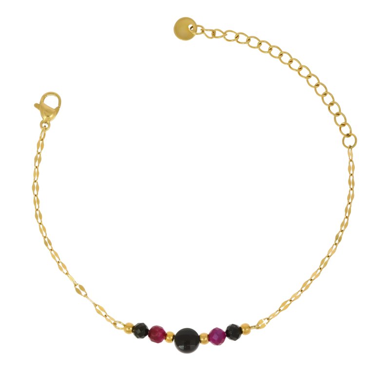 Złota bransoletka ze stali chirurgicznej z kamieniami i zawieszką gwiazdka na białym tle